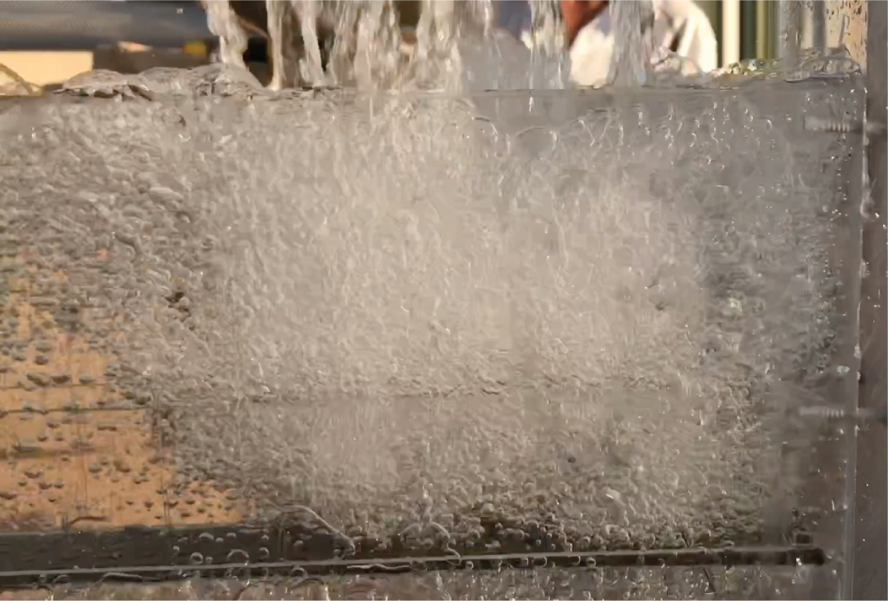 A photograph of a liquid overflow in a water test of a model parting box.