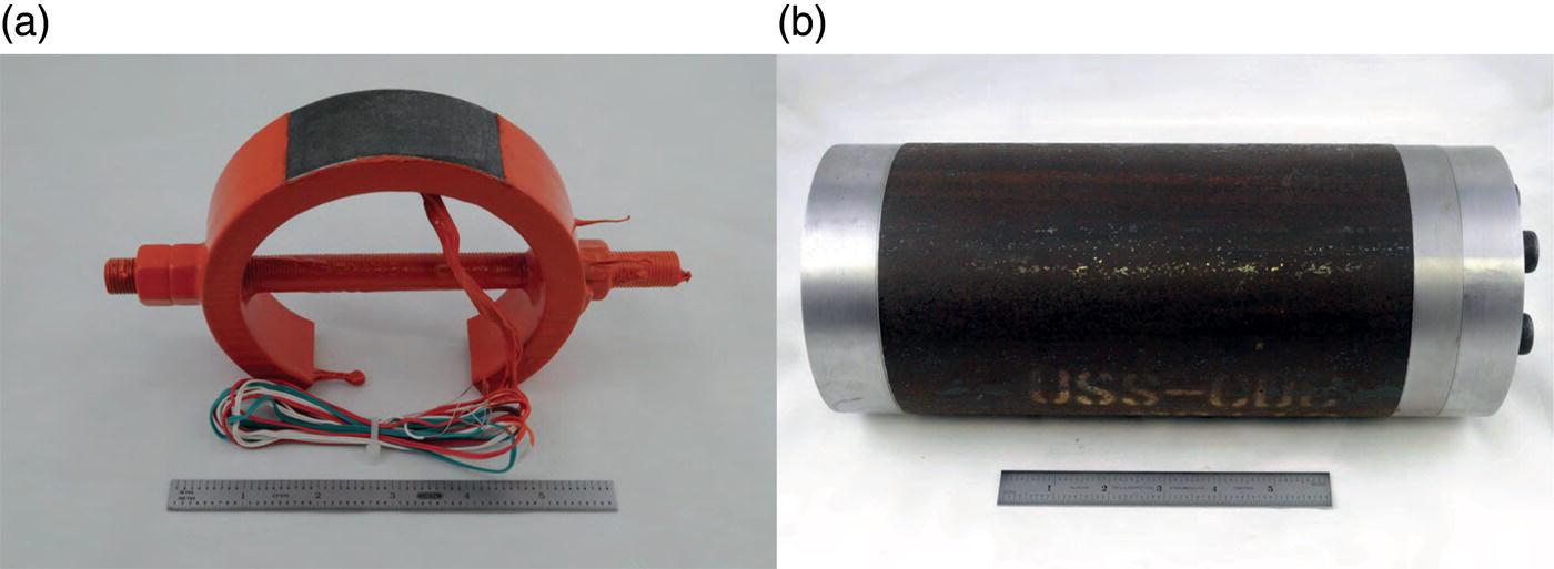 Two images. a. A circular metal object with wires next to a ruler for scale. b. A cylindrical object with textured surface and faint markings is also placed beside a ruler for comparison.