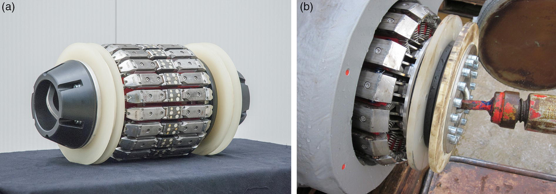 Two images feature cylindrical devices. The first displays a segmented roller covered in a metallic surface, secured by a rim, resting on a flat surface. The design suggests a component used in mechanical or industrial applications. The second presents a similar cylindrical assembly positioned against a backdrop of machinery. This version has additional components and is connected to a tool, indicating some operational process. Both images emphasize the intricate design and engineering of the devices.