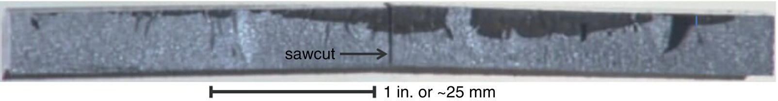 A close-up view of cracking and coalescence typical of secondary cracking near a rupture origin, showing multiple interacting cracks and their merging behavior.