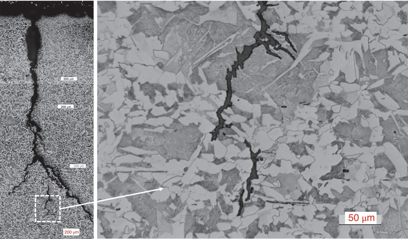 A scanning electron microscope image showing detailed cracks in an etched sample, with a magnified inset highlighting the structure. A scale bar indicates a measurement of 50 µm.