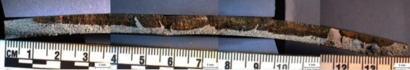 A closer view of image showing a crack profile with a ruler for scale underneath. The caption reads, figure 70.45 Crack profile and surface removed from one panel.